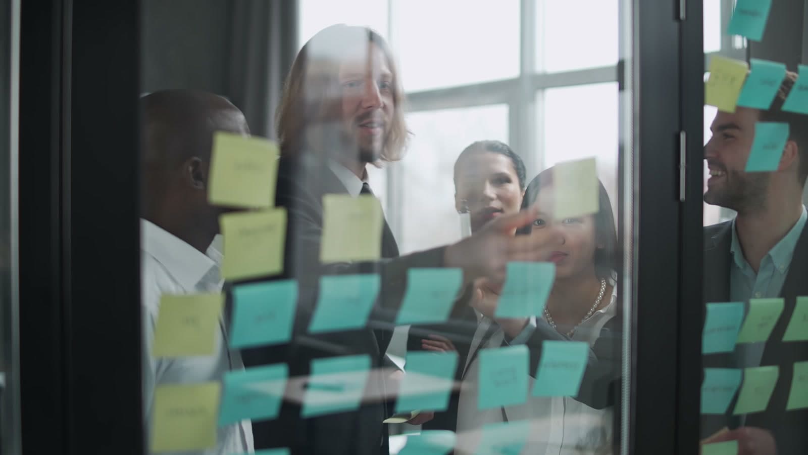 Team mapping enterprise architecture on a glass wall during a Whitehot consulting session in Melbourne.